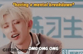 Young Man With Blonde Hair Sitting In Front Of Having A Mental Breakdown Sign GIF