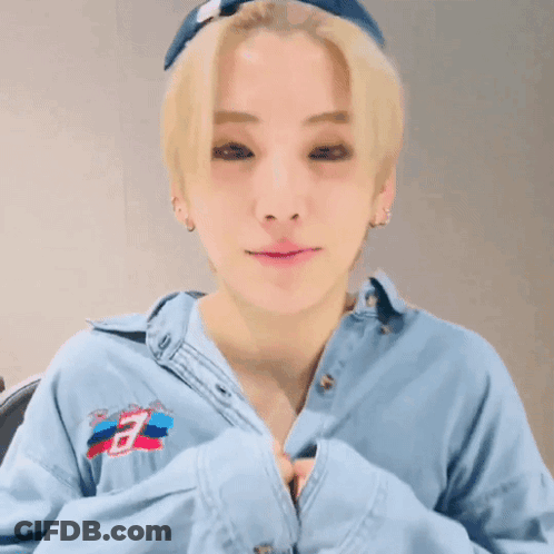 Young Man With Blonde Hair Wearing Blue Shirt With Letter B GIF