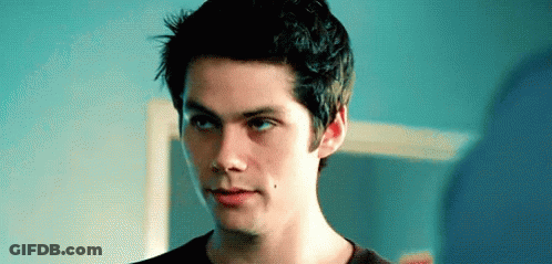 Young Man With Blue Eyes And Black Shirt GIF