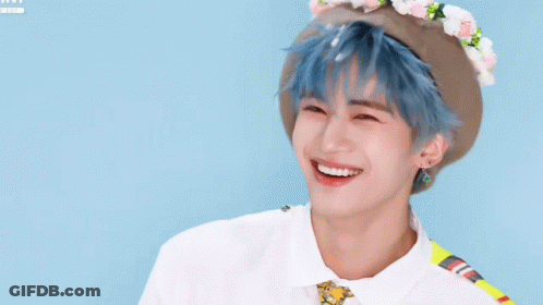 Young Man With Blue Hair And Flower Hat GIF