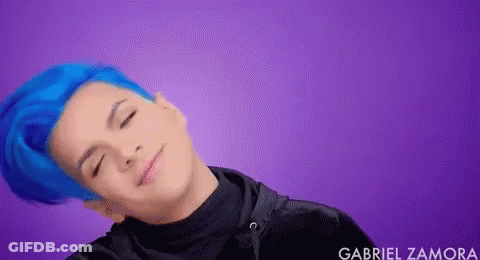 Young Man With Blue Hair Laying Down Eyes Closed Smiling GIF