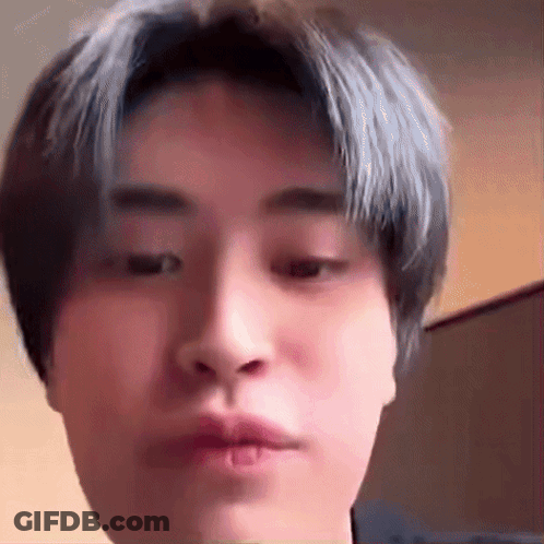 Young Man With Blue Hair Making Funny Face GIF