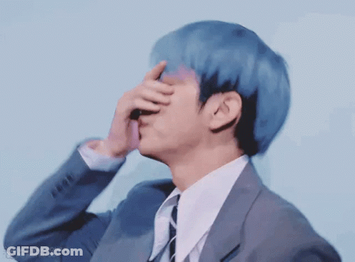 Young Man With Blue Hair Whispering Into Ear GIF