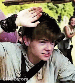 Young Man With Bracelet Touched By Hand GIF