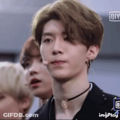 Young Man With Choker And Earrings At Microphone GIF