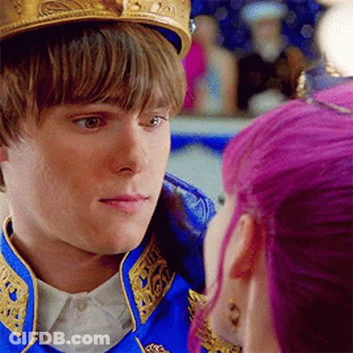 Young Man With Crown Looking At Purple Haired Woman GIF