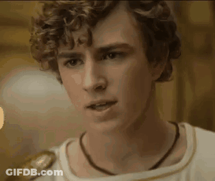 Young Man With Curly Hair And Necklace GIF