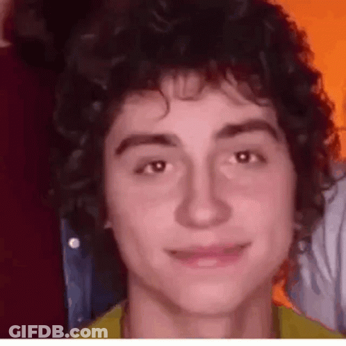 Young Man With Curly Hair Close Up GIF