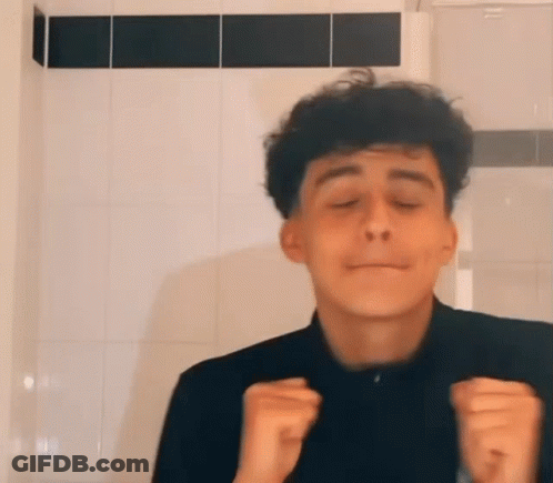 Young Man With Curly Hair Funny Face Tiled Wall GIF