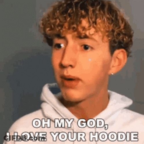 Young Man With Curly Hair In White Hoodie GIF