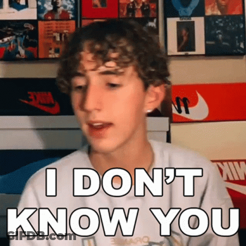 Young Man With Curly Hair Making Funny Face Saying I Don't Know You GIF
