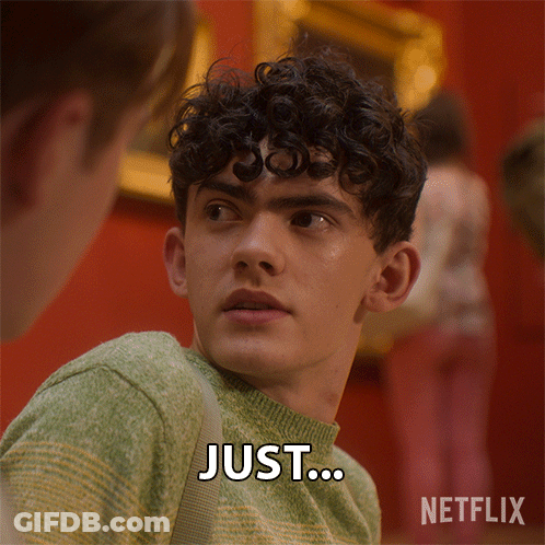 Young Man With Curly Hair Saying Just GIF