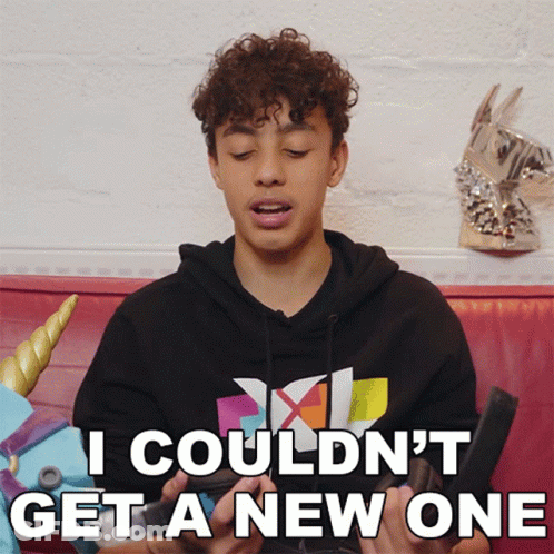 Young Man With Curly Hair Sitting On Couch GIF