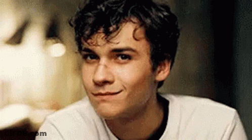 Young Man With Curly Hair Smiling GIF