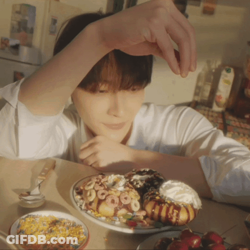 Young Man With Donuts And Cereal GIF