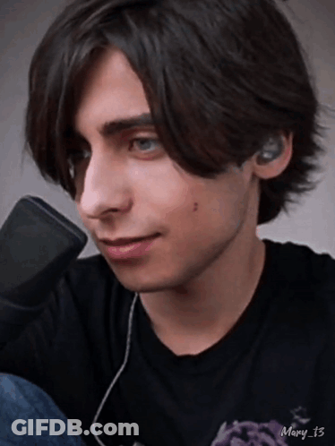 Young Man With Ear Buds And Mary 13 Black Shirt GIF
