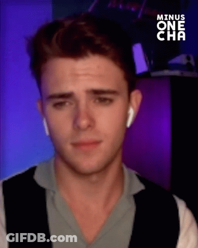 Young Man With Ear Buds Making Funny Face GIF