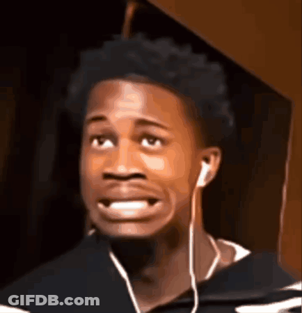 Young Man With Ear Buds Making Funny Face GIF