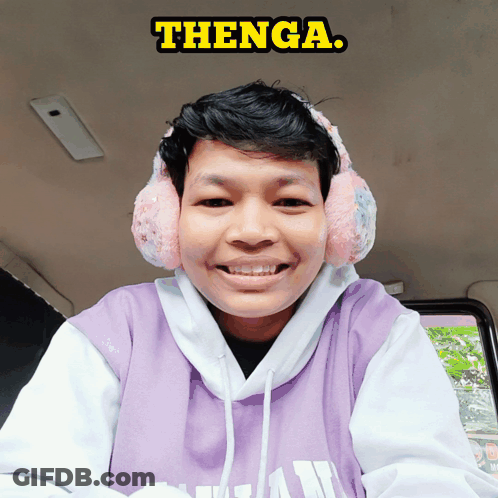 Young Man With Ear Warmers And Purple Shirt Saying Thenga GIF