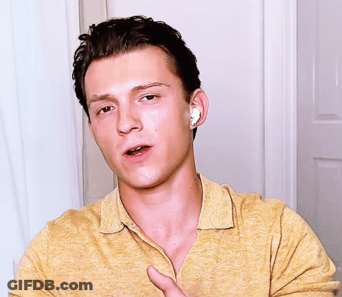 Young Man With Earbuds Making A Face GIF