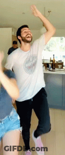 Young Man With Glasses And Black Shirt Among Trees GIF