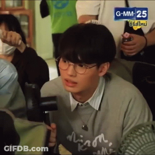 Young Man With Glasses And Gray Sweater GIF