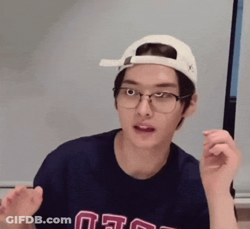 Young Man With Glasses And Hat Making Funny Face GIF
