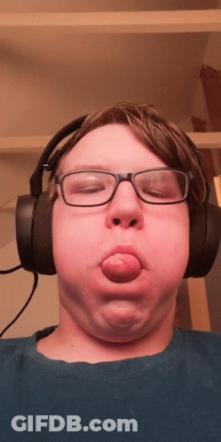Young Man With Glasses And Headphones Making Funny Face GIF