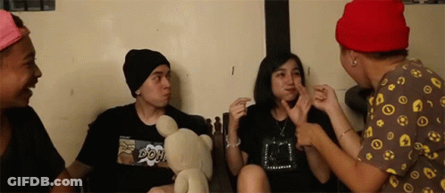 Young Man With Glasses And Headphones Making Funny Face GIF