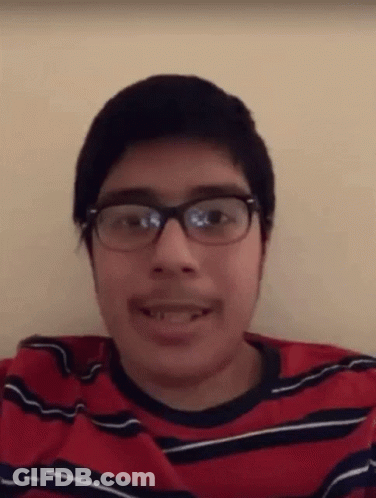 Young Man With Glasses And Mustache In Red And Black Shirt GIF