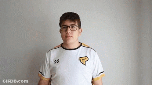 Young Man With Glasses And White Shirt Looking At Camera GIF