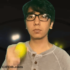 Young Man With Glasses Holding Tennis Ball GIF