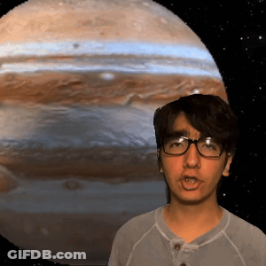 Young Man With Glasses In Front Of Jupiter Background GIF
