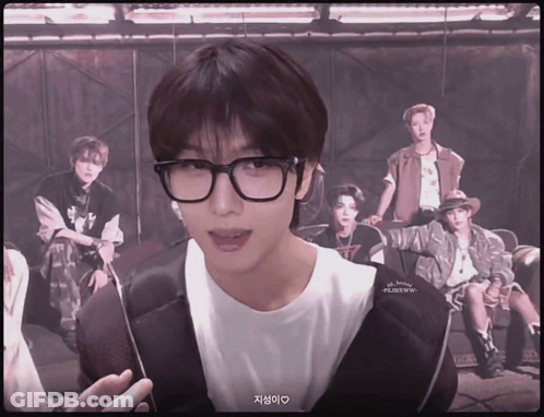 Young Man With Glasses In Front Of Young Men GIF
