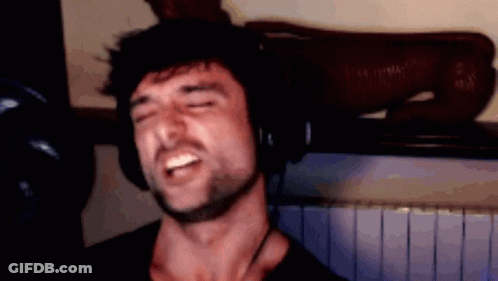 Young Man With Glasses Smiling Tongue Out GIF