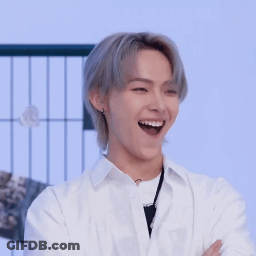 Young Man With Gray Hair And White Shirt Clapping GIF
