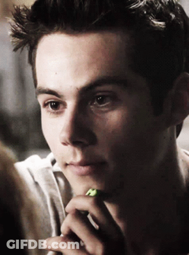 Young Man With Green Pencil Close Up GIF