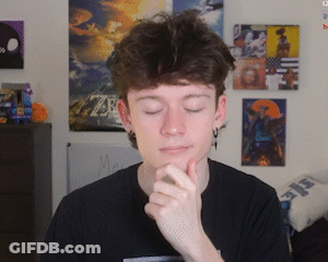 Young Man With Hand On Chin In Front Of Picture Wall GIF