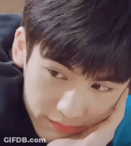Young Man With Hand On Face GIF