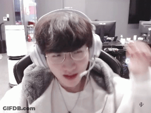 Young Man With Headphones And Glasses At Computer GIF