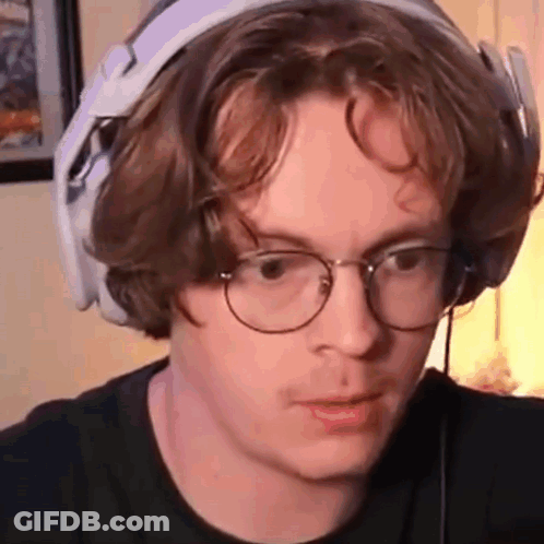 Young Man With Headphones And Glasses Making Funny Face GIF