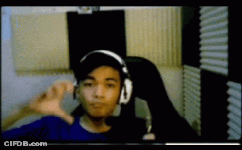 Young Man With Headphones And Hat Thumbs Down GIF