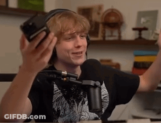 Young Man With Headphones And Microphone At Table GIF