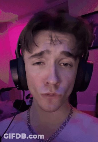 Young Man With Headphones And Purple Chain GIF