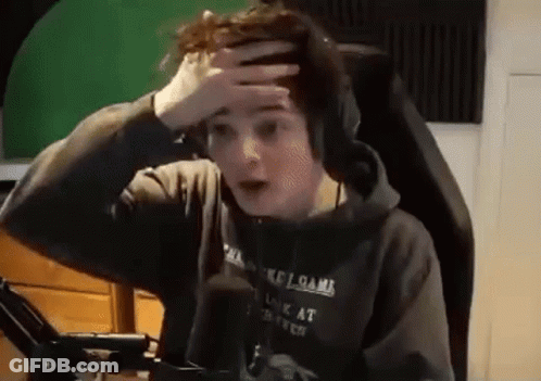 Young Man With Headphones Hand On Head GIF