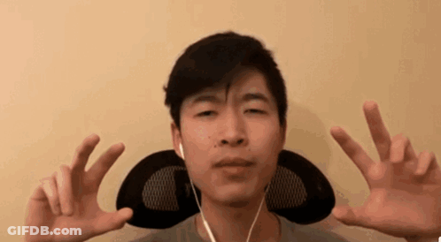 Young Man With Headphones Making Peace Sign GIF