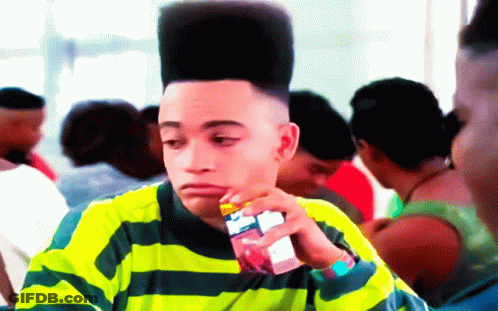 Young Man With High Top Hairstyle Drinking Juice GIF
