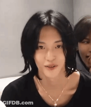 Young Man With Long Black Hair And Necklace GIF