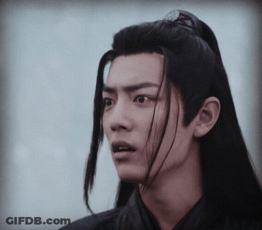 Young Man With Long Black Hair Making Funny Face GIF