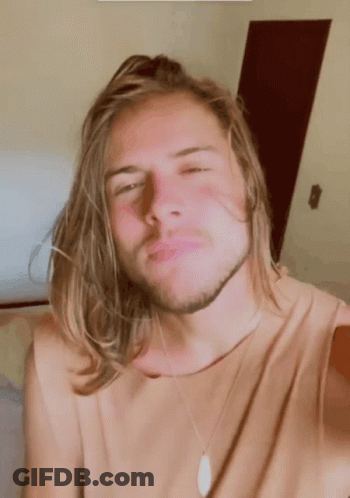 Young Man With Long Blonde Hair And Beard Making Funny Face GIF